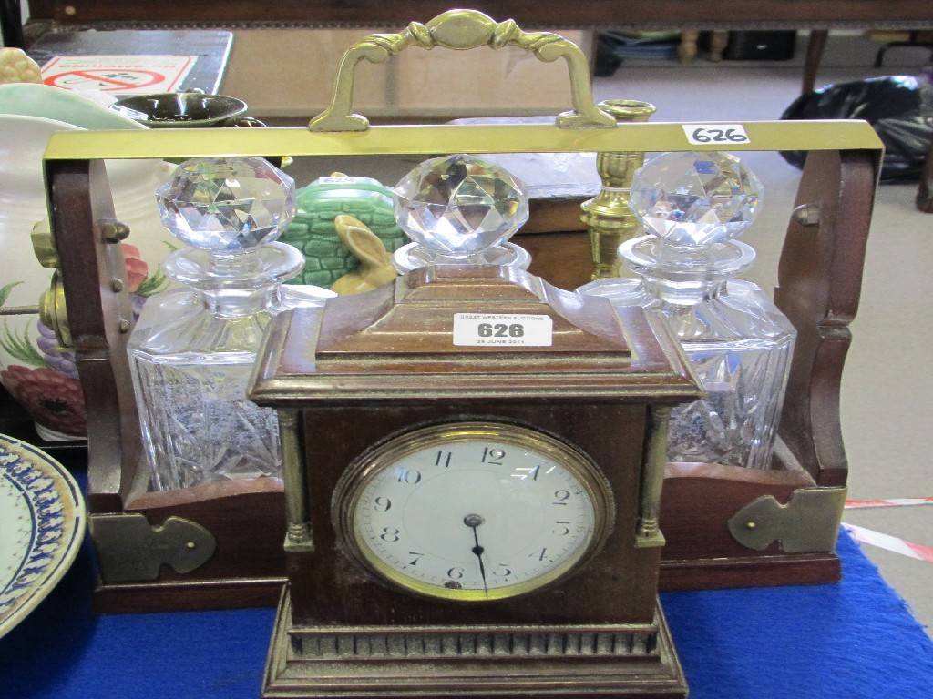 Appraisal: Lot comprising a three decanter tantalus and a mantel clock