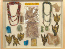 Appraisal: A display case of Egyptian Artifacts including scarabs bead necklaces