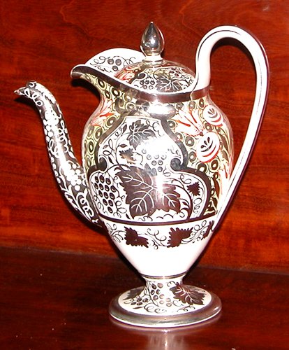 Appraisal: Title Silver Resist Oval-Shaped Teapot with colorful stylized floral decoration