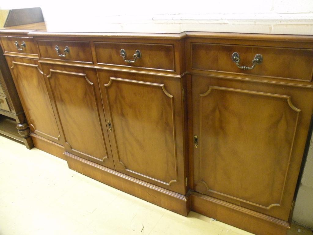 Appraisal: A yew breakfront sideboard