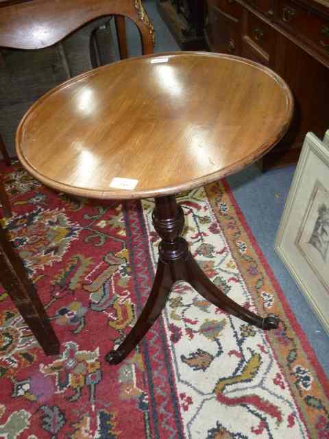 Appraisal: A TH CENTURY MAHOGANY CIRCULAR TILT TOP OCCASIONAL TABLE the