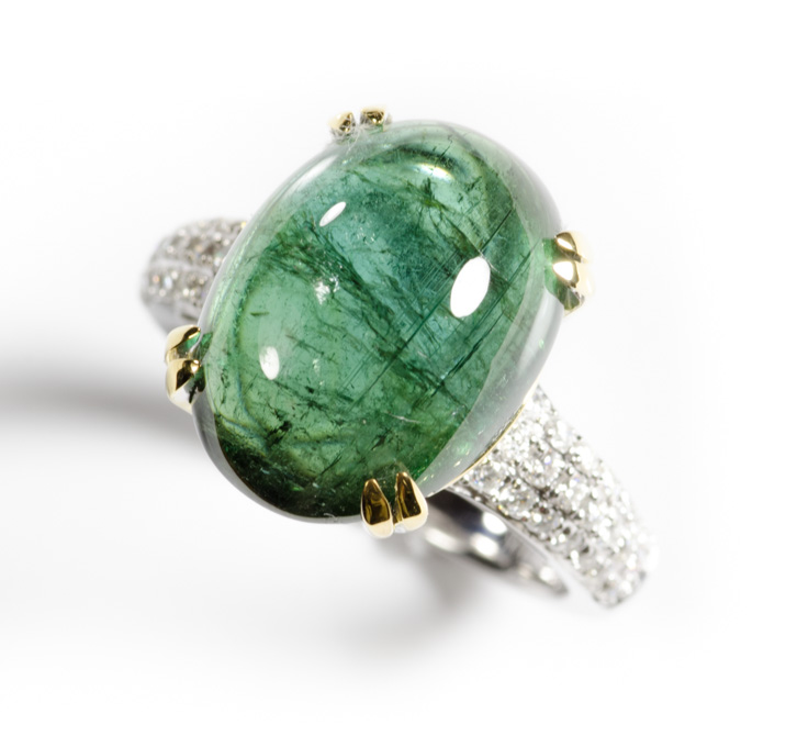 Appraisal: GREEN TOURMALINE AND DIAMOND RING The k white and yellow