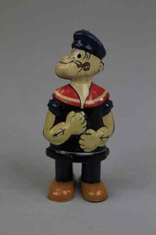 Appraisal: POPEYE WALKER Lithographed tin stand up figure of Popeye with