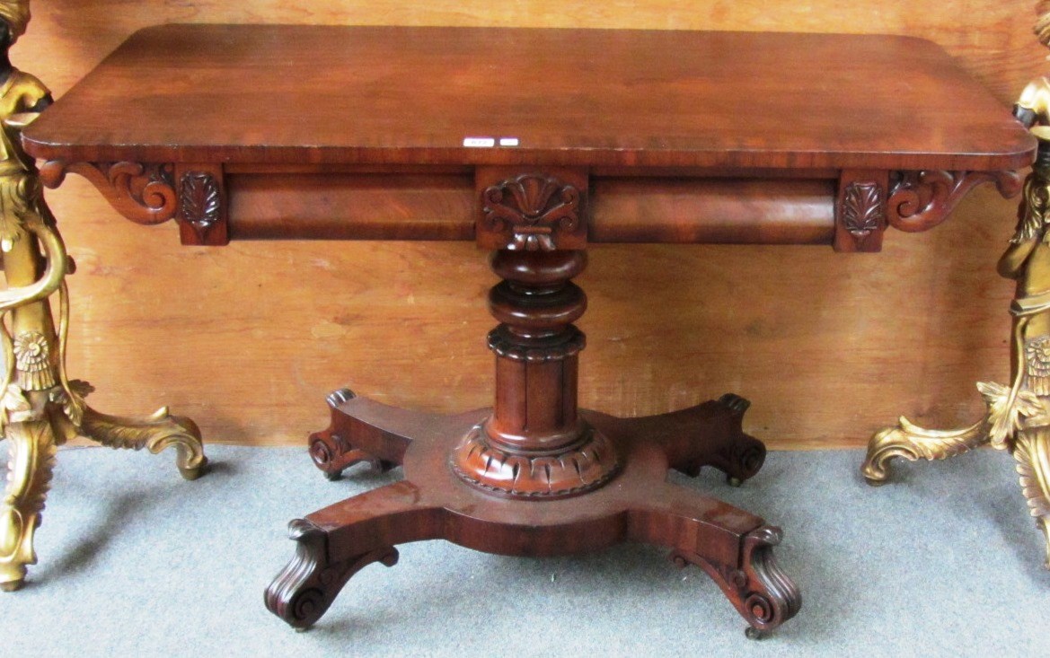 Appraisal: An early Victorian rectangular mahogany centre table on turned column