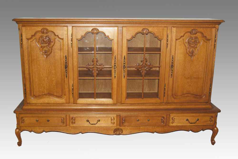 Appraisal: FRENCH STYLE OAK SIDEBOARD CHINA CABINET center glass doors with