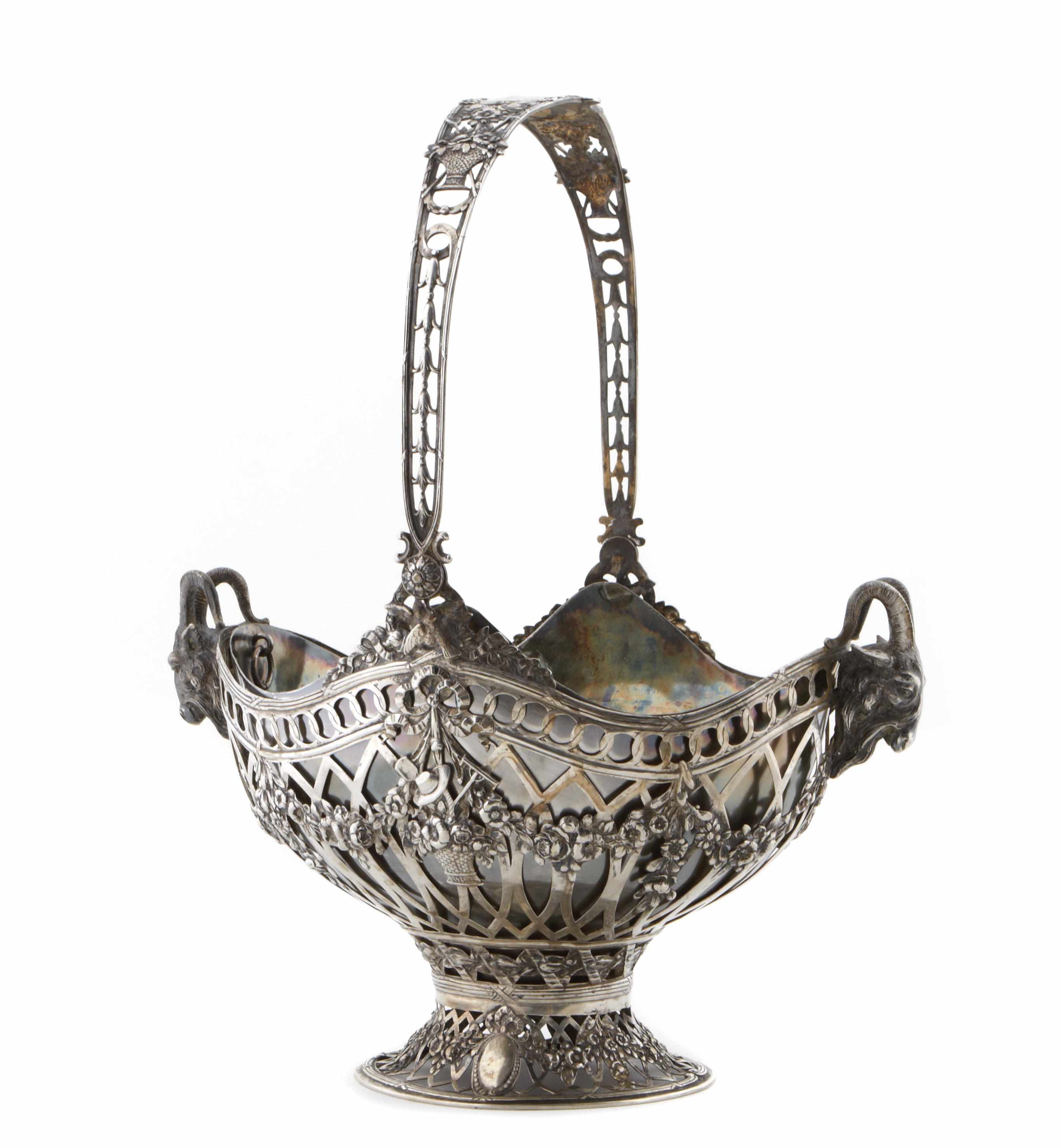 Appraisal: A German standard silver reticulated oval table basket with swing