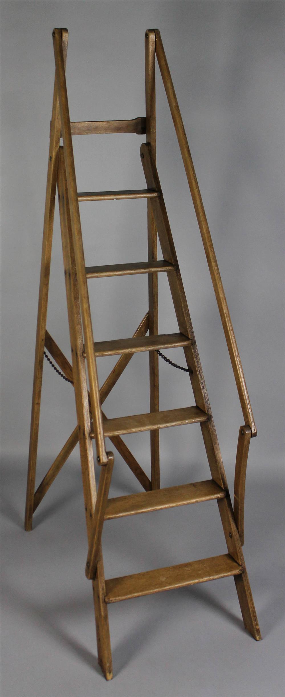 Appraisal: EDWARDIAN BEECHWOOD LIBRARY COLLAPSIBLE LADDER having six steps with side