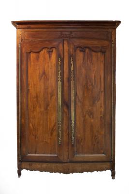 Appraisal: A th Century chestnut armoire with moulded cornice above shaped