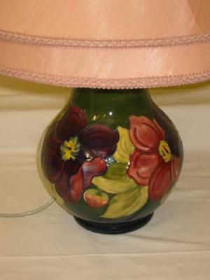 Appraisal: A MOORCROFT POTTERY LAMP of bellied form tube lined in