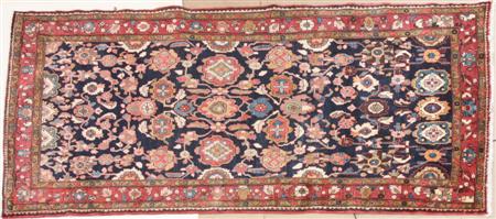 Appraisal: A Hamadan carpet the deep indigo field with boldly drawn