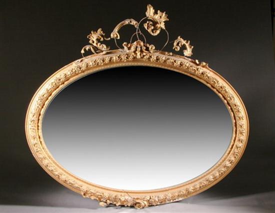 Appraisal: MONUMENTAL GILDED OVAL WALL MIRROR late th early th century