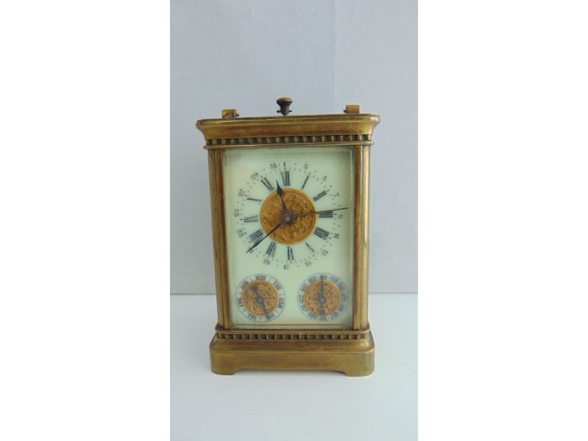 Appraisal: A carriage clock with -day movement subsidiary day and month