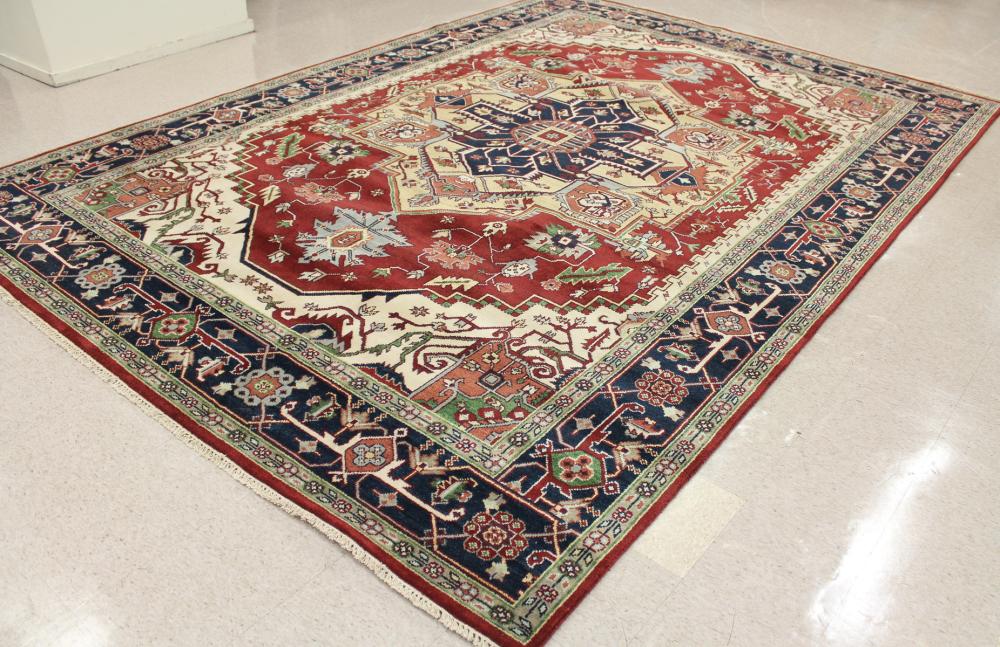 Appraisal: HAND KNOTTED ORIENTAL CARPET Persian Serapi or Heriz design centering