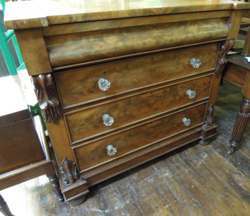 Appraisal: A Victorian mahogany chest fitted with an arrangement of four