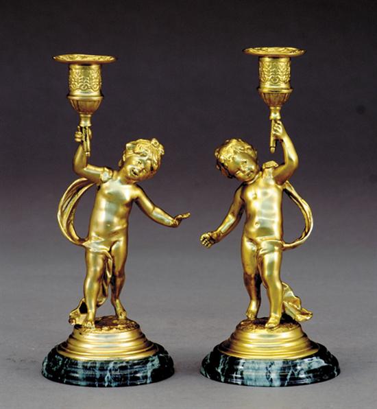 Appraisal: Pair gilt-metal and marble candleholders figure of cherub supporting bobeche