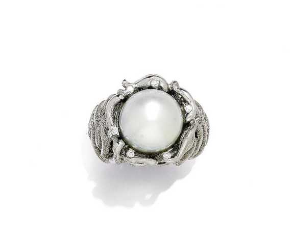 Appraisal: PEARL AND BRILLIANT-CUT DIAMOND RING White gold g Original textured