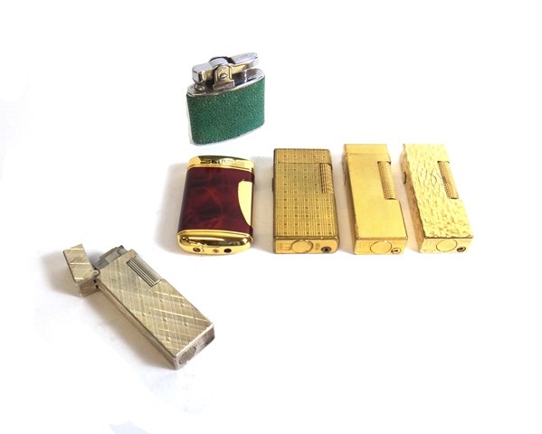 Appraisal: A gilt metal rectangular cased Dunhill gas lighter decorated with