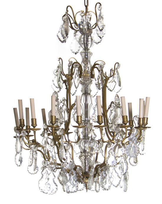 Appraisal: French Gilt Bronze Sixteen-Light Chandelier of cage form having baluster