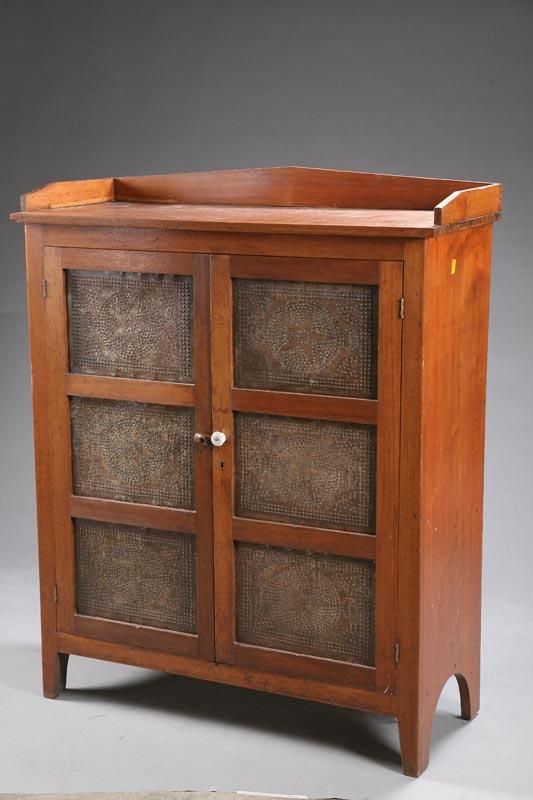 Appraisal: PIE SAFE Walnut with a shaped gallery punched tin doors