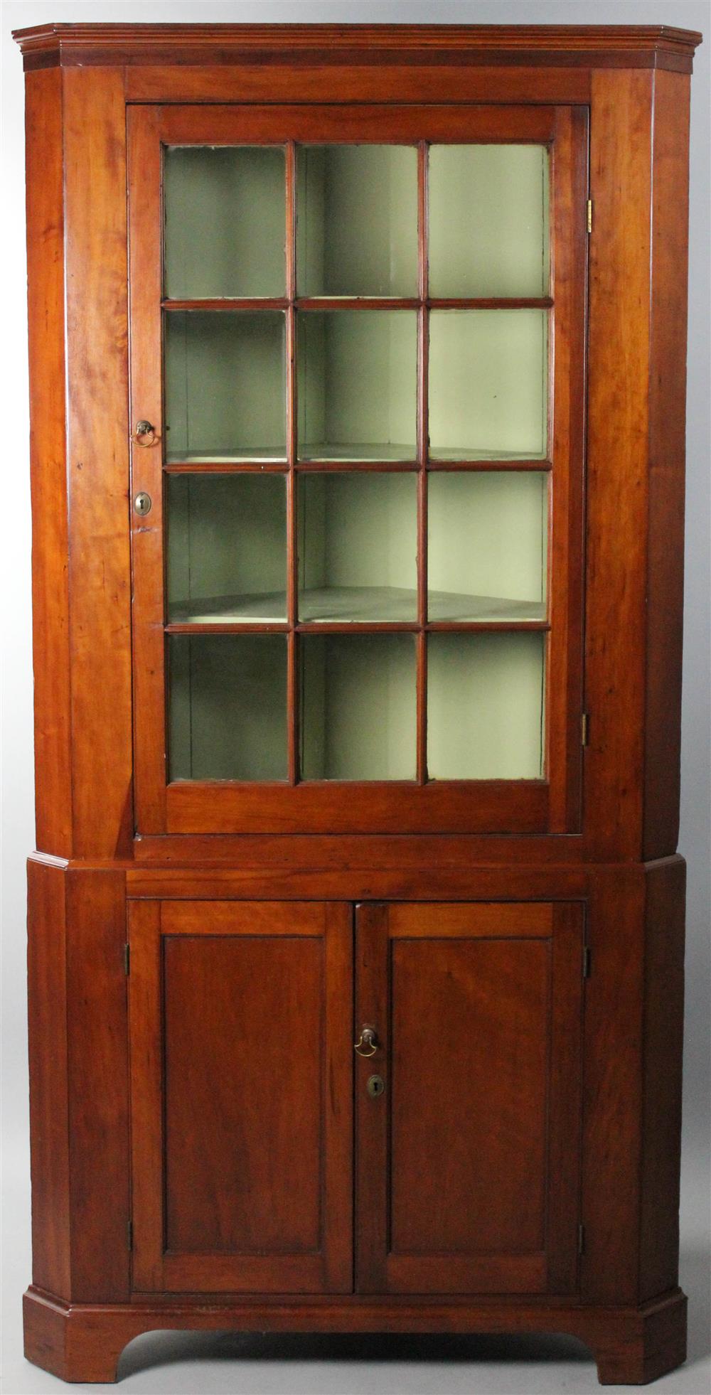 Appraisal: AMERICAN CHERRYWOOD CORNER CUPBOARD CIRCA in two parts the upper