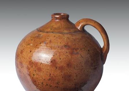 Appraisal: MASSACUSETTS OR MAINE GLAZED REDWARE JUG NINETEENTH CENTURY Of bulbous