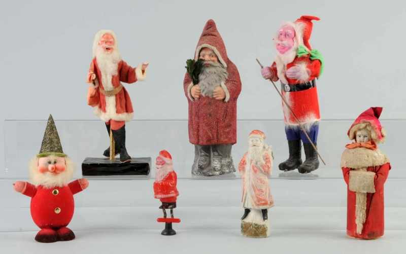 Appraisal: Lot of Christmas Santas Girl with Muff Description Includes one