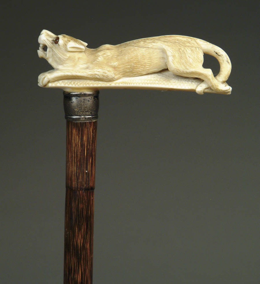 Appraisal: FINE CARVED IVORY CROUCHING TIGER CANE L-shaped handle has a