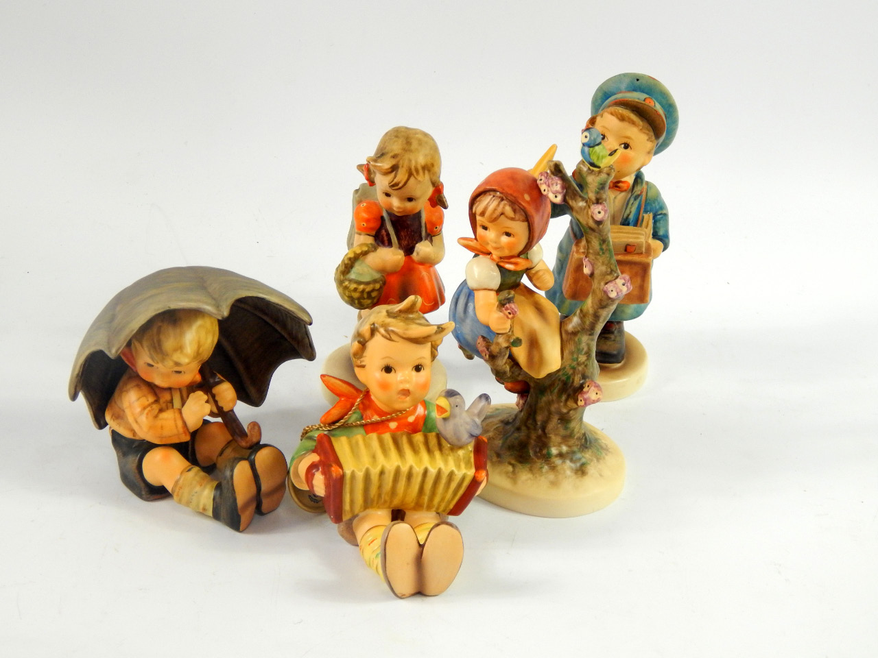 Appraisal: Hummel figures including Umbrella Boy Apple Tree Boy and Apple