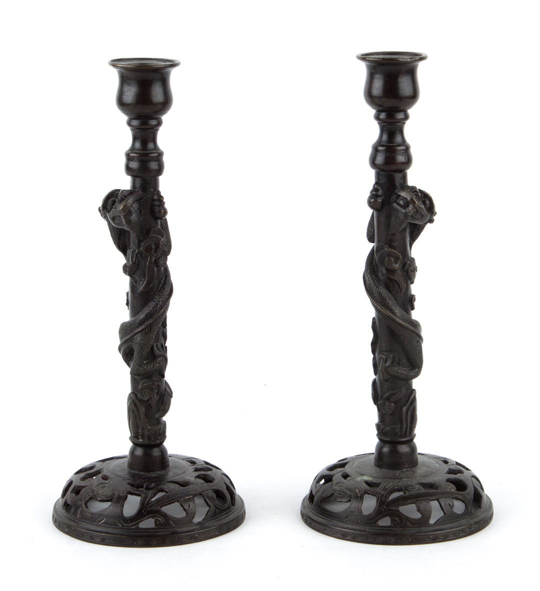 Appraisal: Pair of Chinese cast bronze candlesticks shaft with entwined dragon