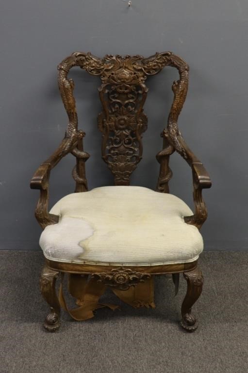 Appraisal: Asian open armchair with finely carved dragons and scrolled fee