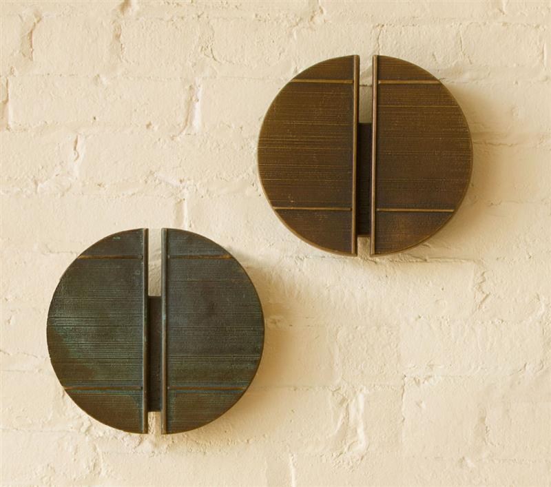 Appraisal: TWO TEXTURED AND PATINATED BRONZE DOOR HANDLES x in diam