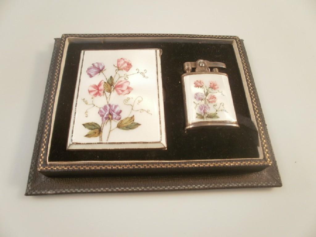 Appraisal: A George VI boxed enamelled Ronson lighter with associated silver