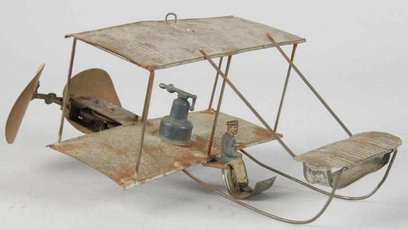 Appraisal: Handpainted Tin Bi-Wing Airplane Wind-Up Toy Description German Working Original