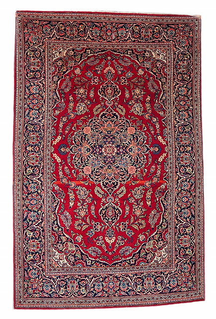 Appraisal: A PERSIAN KASHAN RED GROUND RUG with a central foliate