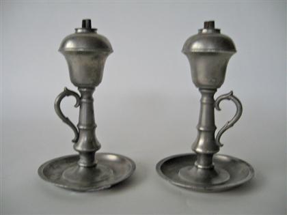 Appraisal: Pair of pewter whale oil lamps Inverted bell form font