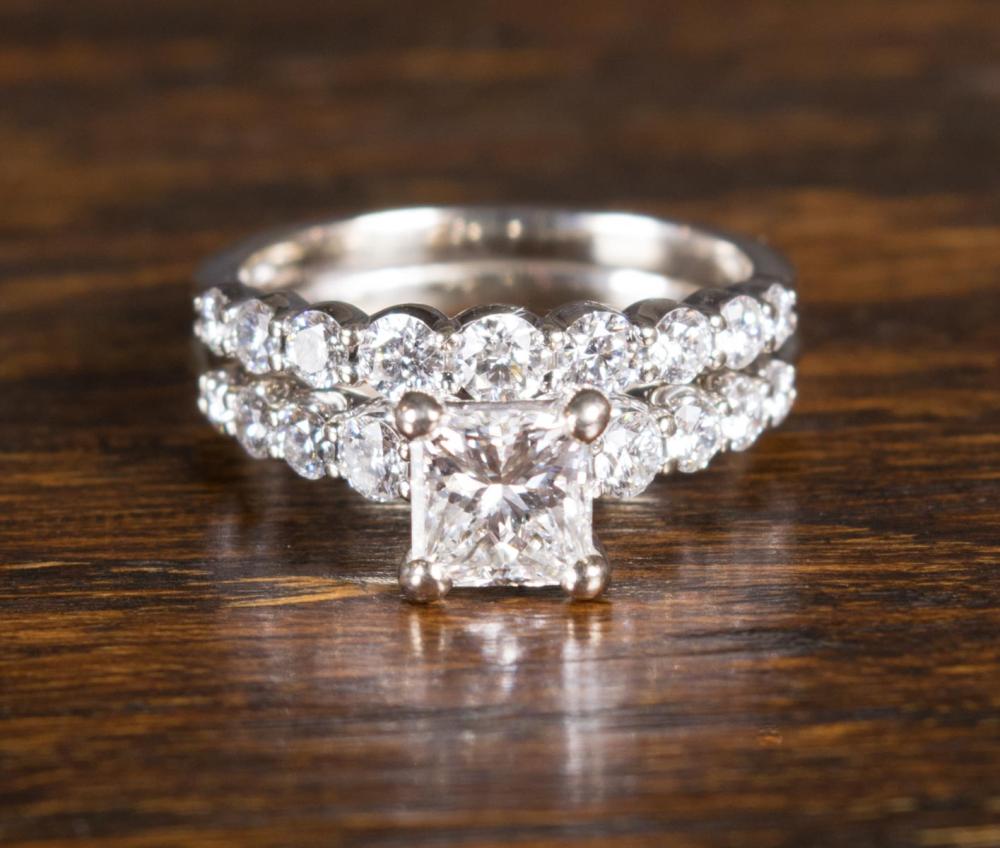 Appraisal: DIAMOND AND FOURTEEN KARAT WHITE GOLD RING with round-cut diamonds