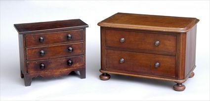 Appraisal: TWO ENGLISH MAHOGANY MINIATURE CHESTS OF DRAWERS Comprising a George