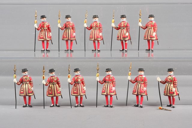 Appraisal: Lot of composition figures representing British Zeoman of the Guard