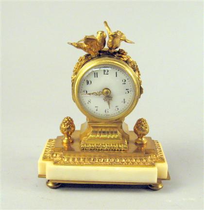 Appraisal: French gilt bronze and marble table clock The barrel case