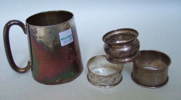 Appraisal: Silver comprising a christening mug of tapering cylindrical form with