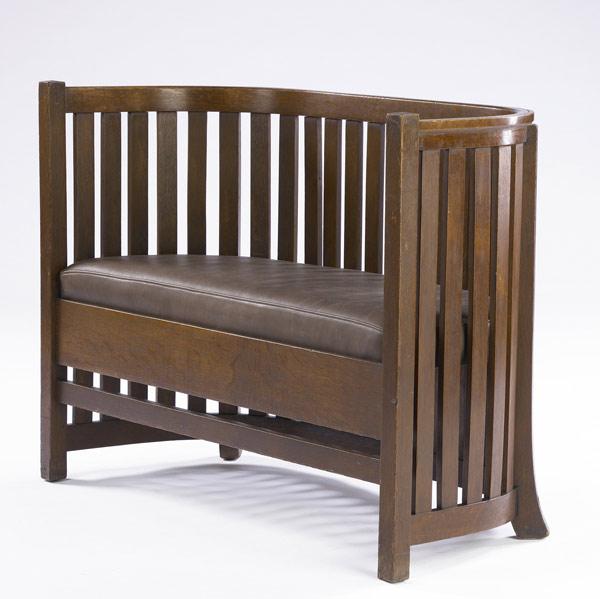 Appraisal: PLAIL BROTHERS Barrel settee with slats to the floor and