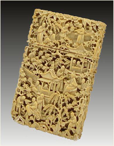 Appraisal: CHINESE INTRICATE CARVED IVORY CARD CASE Profusely carved with images