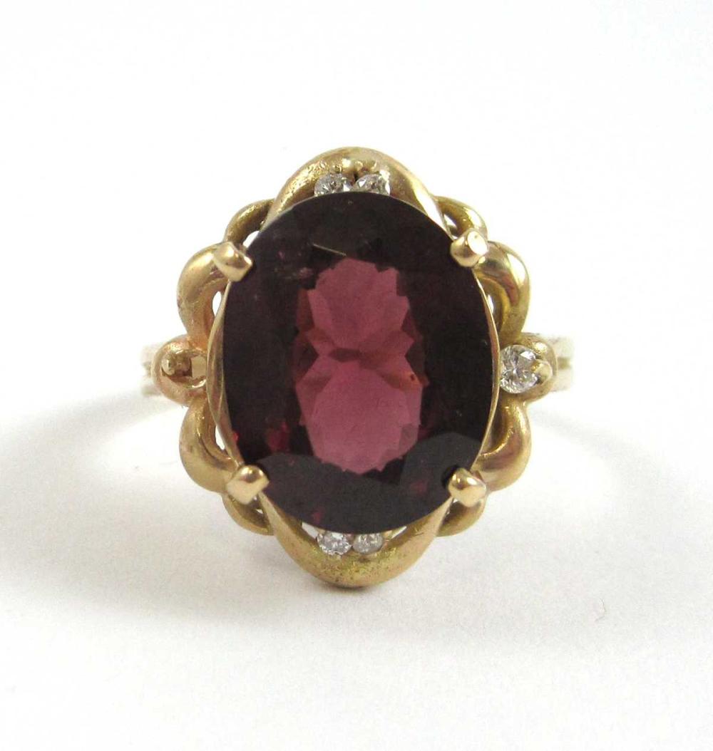 Appraisal: RHODOLITE GARNET DIAMOND AND FOURTEEN KARAT GOLD RING with five