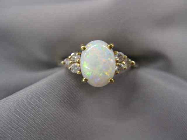 Appraisal: Opal Diamond Ring fiery oval gem with diamonds on each