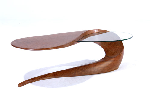 Appraisal: MICHAEL COFFEY Serpent biomorphic coffee table of Bubinga wood with