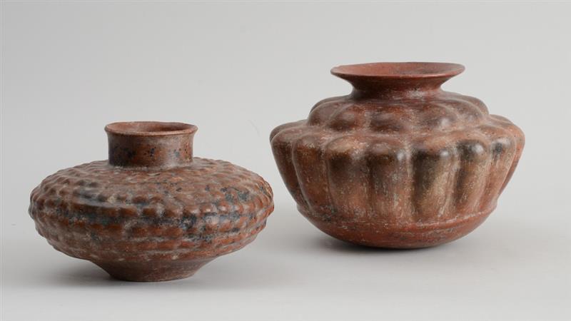 Appraisal: TWO PRE-COLUMBIAN STYLE POTTERY JARS The larger with relief reeded