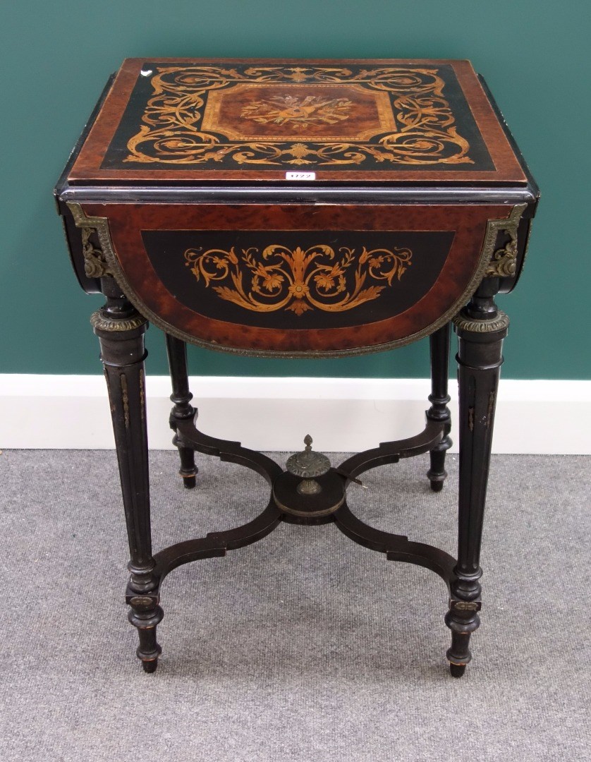 Appraisal: A th century marquetry inlaid gilt metal mounted amboyna and