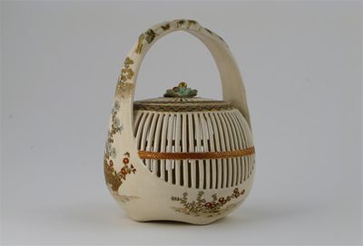 Appraisal: A Japanese Satsuma basket and cover with reticulated ribbing the