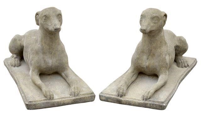 Appraisal: pair Cast stone garden statuary depicting greyhound dog laying on