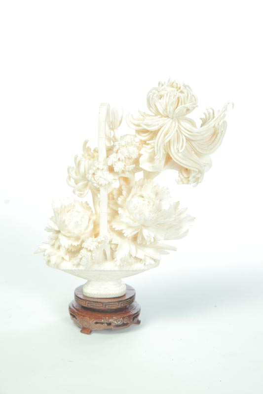 Appraisal: IVORY FLORAL ARRANGEMENT Asian early th century Well- carved basket